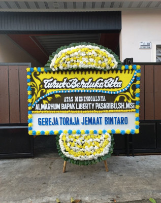 Papan Bunga Duka di Merek